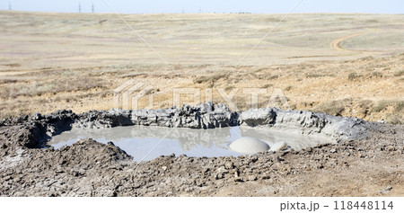 photo of a mud volcano eruption, landscape photography 118448114