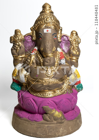 Ganesha idol made of painted clay on white background. Vertical Shot Ganesha idol made of painted clay on white background. Vertical Shot 118448481