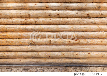 New wooden wall made of uncolored natural pine tree logs, texture 118449176