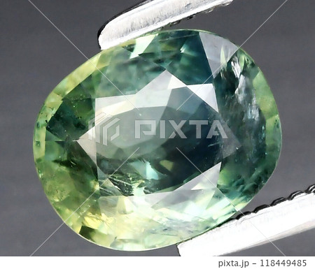 Exquisite Oval Green Sapphire Gemstone Captured in Close-Up Elegance 118449485