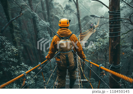 Adventurer Crossing a Suspended Bridge in Misty Forest 118450145