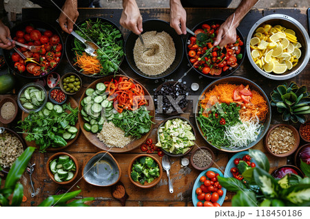 Colorful Assortment of Fresh Ingredients. Overhead view of various fresh foods being prepared on a rustic table. 118450186