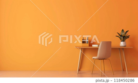 Minimalist Home Office Setup. A clean desk with chair against an orange wall, embodying a minimalist style. 118450286