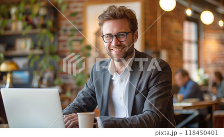 Smiling Man with Laptop at Coffee Shop 118450401