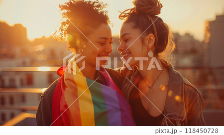Affectionate Couple with Pride Flag at Sunset 118450728