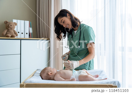 Nurse vaccinates newborn at hospital providing protection against diseases Nurse vaccinates newborn at hospital providing protection against diseases 118451103