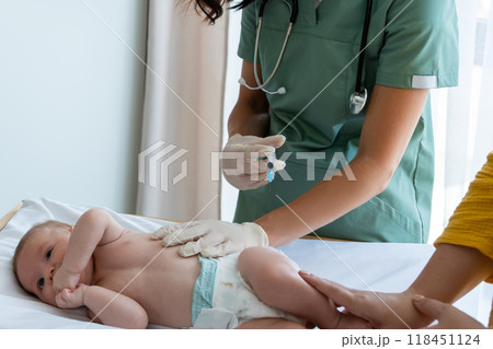 Nurse vaccinates newborn at hospital providing protection against diseases Nurse vaccinates newborn at hospital providing protection against diseases 118451124