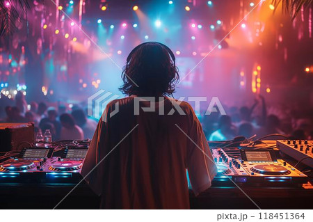 DJ at the Turntable in a Vibrant Club Setting 118451364