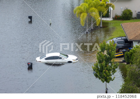 Flooded car and house from hurricane Debby rainfall water in Laurel Meadows community in Sarasota, Florida. Aftermath of natural disaster in USA south Flooded car and house from hurricane Debby rainfall water in Laurel Meadows community in Sarasota, Florida. Aftermath of natural disaster in USA south 118452068