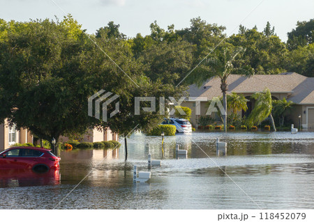 Flooded residential area with underwater houses and cars from hurricane Debby rainfall water in Laurel Meadows community in Sarasota, Florida. Aftermath of natural disaster in southern USA Flooded residential area with underwater houses and cars from hurricane Debby rainfall water in Laurel Meadows community in Sarasota, Florida. Aftermath of natural disaster in southern USA 118452079