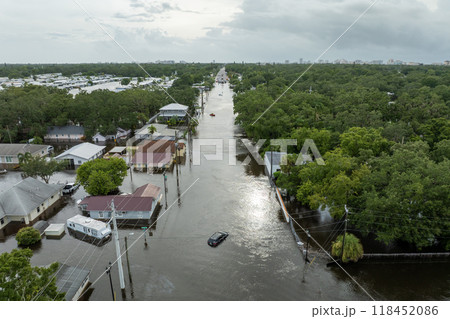 Flooding in Florida caused by tropical storm from hurricane Debby. City houses in residential community surrounded by flood waters in Sarasota. Aftermath of natural disaster 118452086