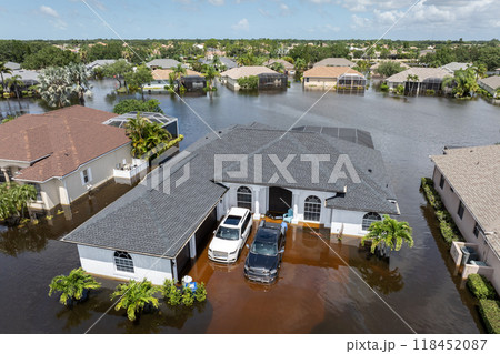 Flooding in Florida caused by tropical storm from hurricane Debby. Suburb houses in Laurel Meadows residential community surrounded by flood waters in Sarasota. Aftermath of natural disaster Flooding in Florida caused by tropical storm from hurricane Debby. Suburb houses in Laurel Meadows residential community surrounded by flood waters in Sarasota. Aftermath of natural disaster 118452087