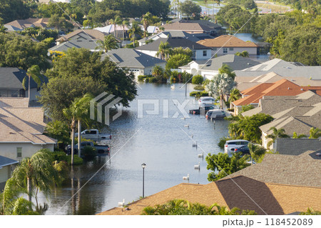 Flooding in Florida caused by tropical storm from hurricane Debby. Suburb houses in Laurel Meadows residential community surrounded by flood waters in Sarasota. Aftermath of natural disaster Flooding in Florida caused by tropical storm from hurricane Debby. Suburb houses in Laurel Meadows residential community surrounded by flood waters in Sarasota. Aftermath of natural disaster 118452089