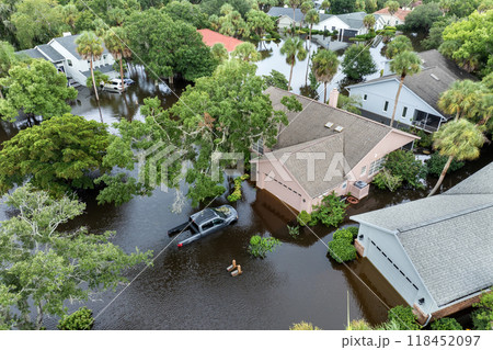 Hurricane Debby flooded homes and cars in residential community in Sarasota, Florida. Aftermath of natural disaster 118452097