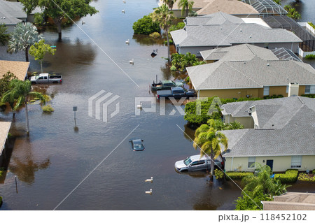 Hurricane Debby tropical rainstorm flooded residential homes and cars in suburban community in Sarasota, Florida. Aftermath of natural disaster Hurricane Debby tropical rainstorm flooded residential homes and cars in suburban community in Sarasota, Florida. Aftermath of natural disaster 118452102