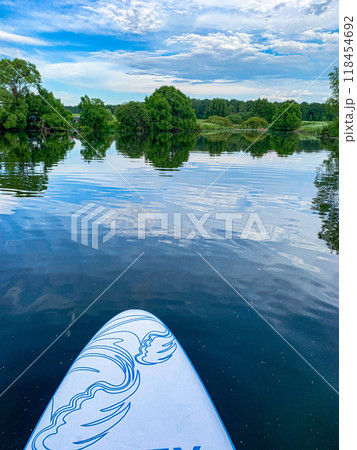 A view of the quiet surface of the lake from a sup board. A view of the quiet surface of the lake from a sup board. 118454692