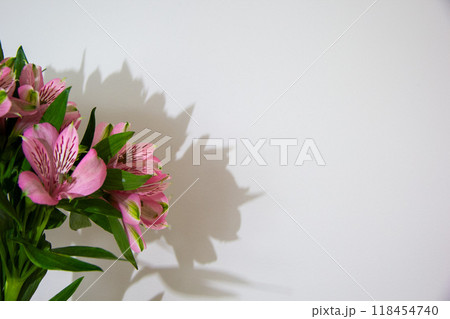 Pink cherry blossoms in glass vase, spring interior flower arrangement, copy space 118454740