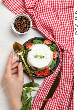 Ricotta in a bowl with fresh tomatoes and herbs 118456856