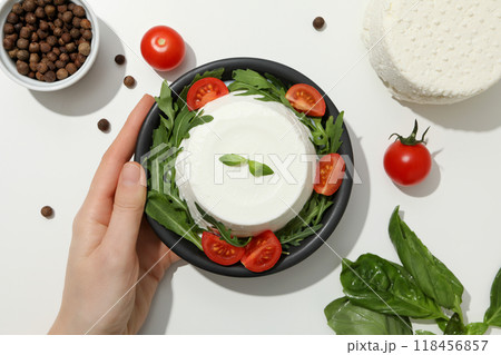 Ricotta in a bowl with fresh tomatoes and herbs 118456857
