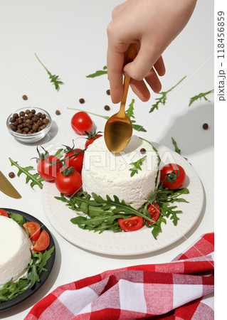 Ricotta in a bowl with fresh tomatoes and herbs Ricotta in a bowl with fresh tomatoes and herbs 118456859