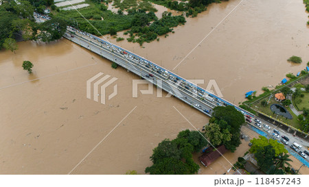 Aerial view of car stuck on the bridge after road flooded during typhoon Yagi has swept Southeast Asia. Aerial view of car stuck on the bridge after road flooded during typhoon Yagi has swept Southeast Asia. 118457243