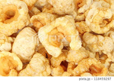 Closeup of pork snack or pork rinds, deep fried pork skin and blistered is traditional food in the north of Thailand. 118459297