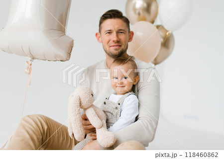 Dad and little son on the background of balloons Dad and little son on the background of balloons 118460862
