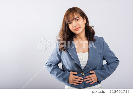 Portrait of Asian beautiful young woman has stomachache, female abdominal pain suffering from stomach ache, studio shot isolated on white background, period pain, Health and medical gastritis concept Portrait of Asian beautiful young woman has stomachache, female abdominal pain suffering from stomach ache, studio shot isolated on white background, period pain, Health and medical gastritis concept 118461735