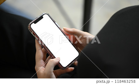 Close up shot of young man holding smartphone with white empty screen Close up shot of young man holding smartphone with white empty screen 118463258