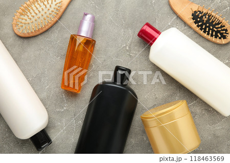 A lot of different cosmetic products for hair care on grey background. 118463569