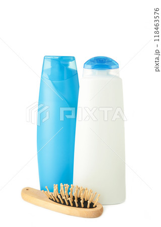 White and blue shampoo bottle with wooden combon isolated on white background. 118463576