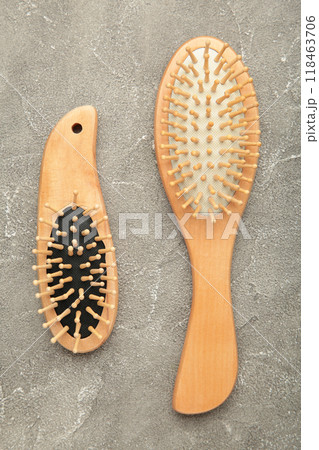 Set of comb and hairbrush on grey background. 118463706