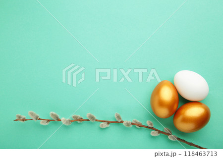 Eggs with willow branches on mint. Symbols of spring and easter Eggs with willow branches on mint. Symbols of spring and easter 118463713