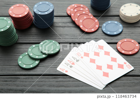 Poker chips on black wooden background. Casino 118463734