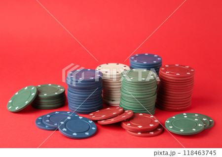 Poker chips on a red background. Casino 118463745