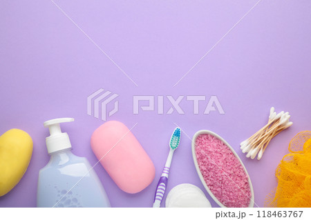 Bottle of pink shower gel, soap, bath salt and toothbrush on purple background 118463767