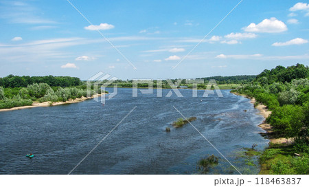 River with trees on the banks flowing beyond the horizon River with trees on the banks flowing beyond the horizon 118463837