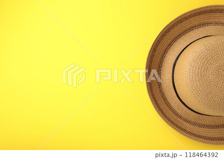 Summer panama straw hat on yellow background. Summer panama straw hat on yellow background. 118464392