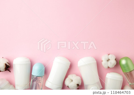 Different deodorants with cotton on pink background with copy space. Different deodorants with cotton on pink background with copy space. 118464703