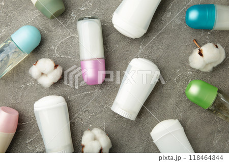Different deodorants with cotton on grey background. Different deodorants with cotton on grey background. 118464844