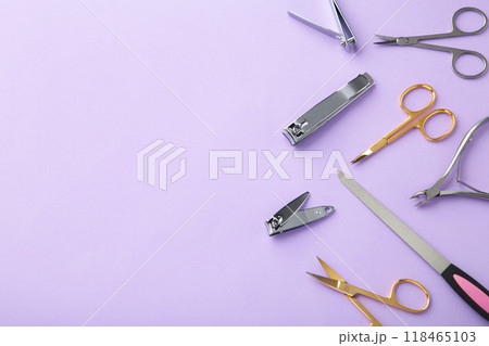 Tools of a manicure set on purple background with copy space Tools of a manicure set on purple background with copy space 118465103