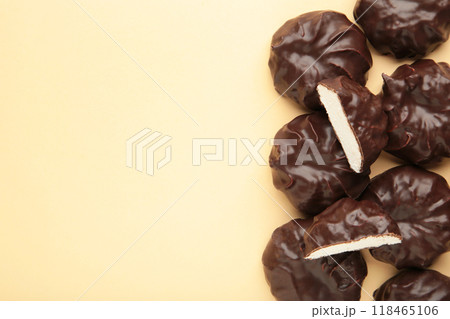 Chocolate covered marshmallows on beige background with copy space. Minimalism 118465106