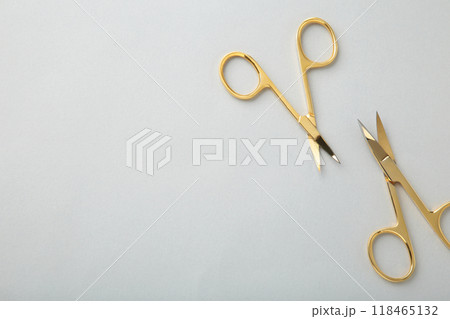 Scissors for manicure woman nails on grey background with copy space Scissors for manicure woman nails on grey background with copy space 118465132