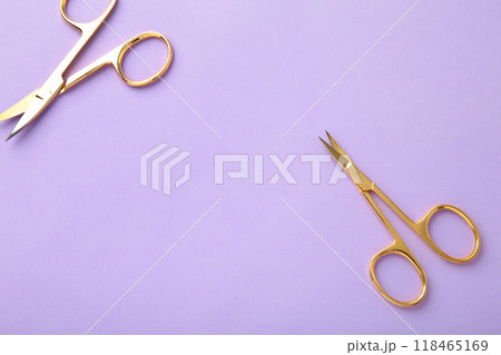 Scissors for manicure woman nails on purple background with copy space Scissors for manicure woman nails on purple background with copy space 118465169
