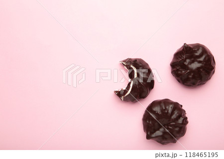 Chocolate covered marshmallows on pink background. Minimalism 118465195