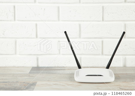 Wireless Wi-Fi router on a white background with copy space Wireless Wi-Fi router on a white background with copy space 118465260