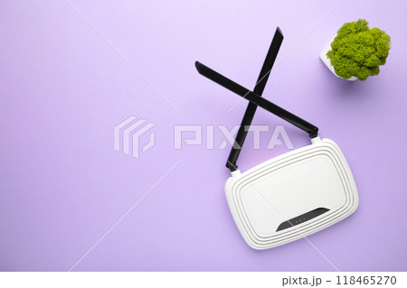 Wireless Wi-Fi router on purple background with copy space 118465270
