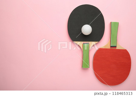 Ping pong rackets and ball on pink background with copy space. 118465313