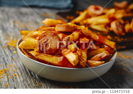 typical german dish currywurst and chips 118471558