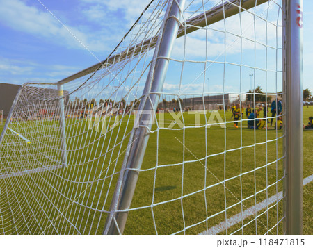 Close up. Soccer player wearing red cleat with small spikes for grip 118471815